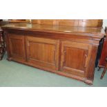 A large late 19th/early 20th century oak chest, having hinged lid, moulded panelled front and reeded