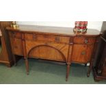 A 19th century mahogany breakfront sideboard with crossbanded and line inlaid decoration, fitted