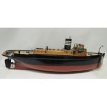 A large battery powered model of a steam boat, the painted wood model with good deck detail and with