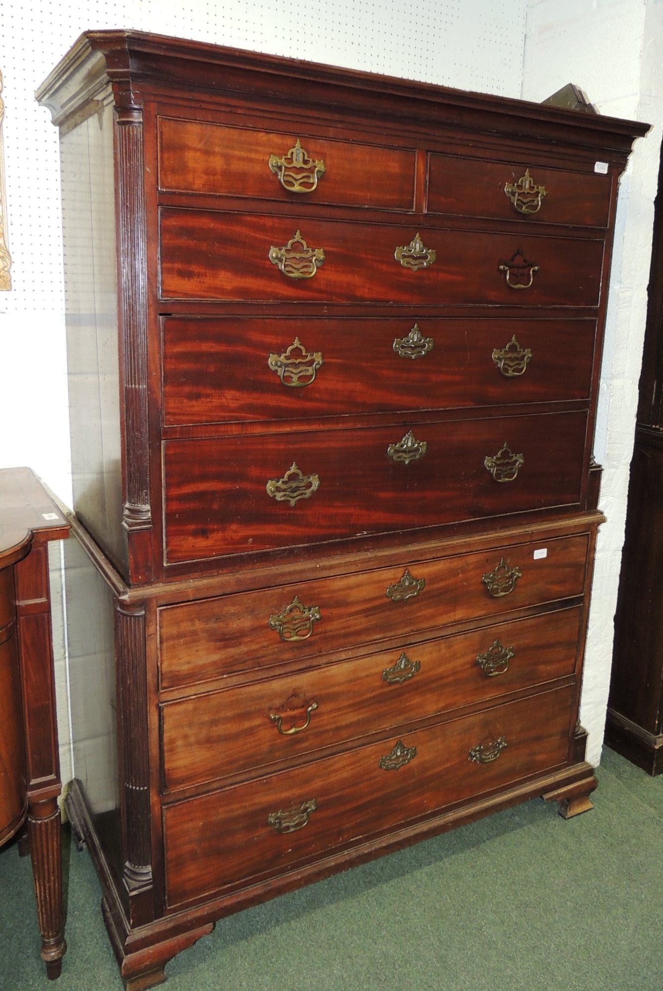 A 19th century mahogany veneer on oak carcass chest on chest, having moulded pediment, reeded