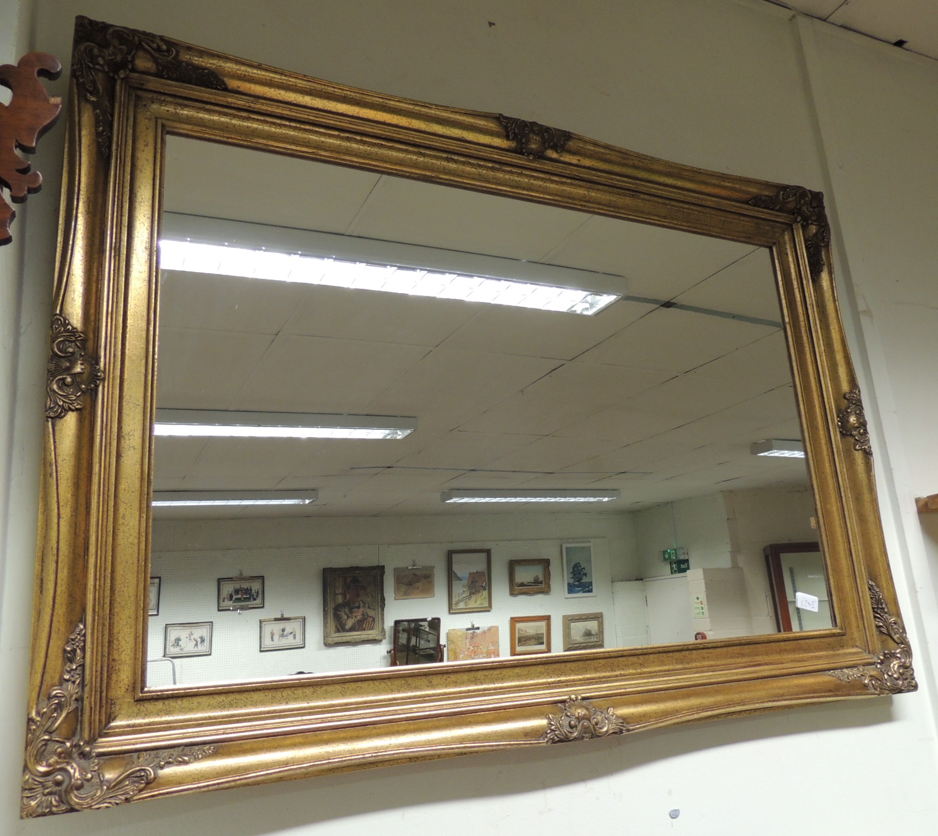 A modern rectangular gilt frame wall mirror, 79cm x 110cm.