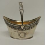 A Victorian silver bon bon dish of navette shape with openwork swing handle, the edge with