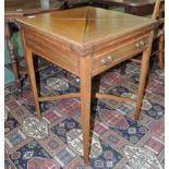 An Edwardian mahogany envelope card table, with line inlaid and crossbanded decoration, having