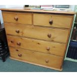 A pine chest of two short and three long drawers, 103cm high, 114cm wide.
