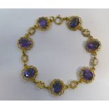 9CT GOLD MOUNTED DECORATIVE BRACELET,