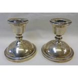 PAIR OF CIRCULAR BASED SILVER CANDLESTICKS ,