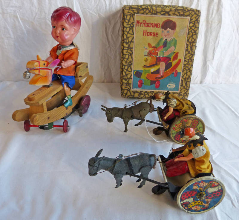 TWO LEHMANN TINPLATE CLOWNS ON HORSE DRAWN CARTS TOGETHER WITH JAPANESE TINPLATE BOY ON WOODEN