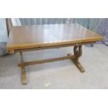 OLD CHARM OAK PULL-OUT REFECTORY TABLE ON SHAPED SUPPORTS