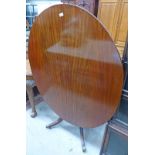 LATE 19TH CENTURY MAHOGANY OVAL BREAKFAST TABLE ON SPREADING SUPPORTS