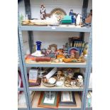 FOUR SHELVES OF INTRESTING ITEMS TO INCL TANKARDS, BRASSWARE, CLOCKS, EGYPTAIN ITEMS, BOOKS,