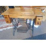 OAK CASED SINGER TREADLE SEWING MACHINE Condition Report: Overall good condition.