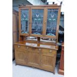 EARLY 20TH CENTURY ARTS & CRAFTS MAHOGANY BOOKCASE WITH 3 LEADED GLASS PANEL DOORS OVER 2 DRAWERS