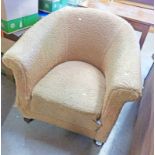 20TH CENTURY OVERSTUFFED TUB CHAIR ON TURNED SUPPORTS
