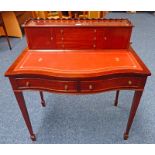 20TH CENTURY MAHOGANY DESK WITH DRAWER GALLERY SHAPED FRONT & 2 DRAWERS ON TAPERED SUPPORTS