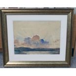 GILT FRAMED WATERCOLOUR SUNSET OVER A HIGHLAND LOCH INDISTINCTLY SIGNED - 40 X 54 CM