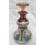 19TH CENTURY RUBY GLASS DECANTER WITH ENAMEL & GILT OVERLAID FLORAL DECORATION,