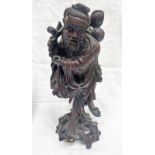 CHINESE ROOT WOOD CARVING OF A MAN CARRYING FRUIT,