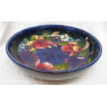 BLUE MOORCROFT BOWL DECORATED WITH FRILLED ORCHIDS SIGNED W M TO BASE,