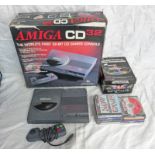 AMIGA CD32 TOGETHER WITH A SELECTION OF GAMES INCLUDING Z00L, JAMES POND : ROBOCOD,