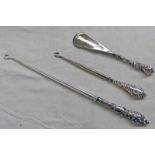 2SILVER BUTTON HOOKS AND A SILVER HANDLED SHOE HORN