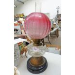 EARLY 20TH CENTURY OIL LAMP WITH ETCHED CRANBERRY GLASS SHADE Condition Report: