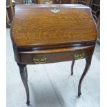 EARLY 20TH CENTURY OAK BUREAU WITH FALL FRONT & FITTED INTERIOR & SINGLE DRAWER ON SHAPED SUPPORTS