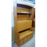 20TH CENTURY TEAK BOOKCASE WITH FALL FRONT TWO PANEL DOORS