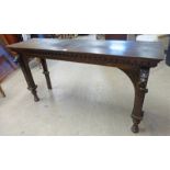 LATE 19TH CENTURY CARVED OAK HALL TABLE WITH LIONS HEAD DECORATION AND TURNED SUPPORTS