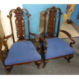 PAIR OF 19TH CENTURY CHINESE STYLE WALNUT LOW ARMCHAIRS WITH CARVED DECORATIVE BACKS & SHAPED