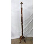 EARLY 20TH CENTURY MAHOGANY STANDARD LAMP WITH REEDED COLUMN.