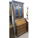 EARLY 20TH CENTURY OAK BUREAU BOOKCASE WITH 2 LEADED GLASS DOORS OVER FALL FRONT OVER 3 DRAWERS ON