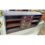 LATE 20TH CENTURY MAHOGANY OPEN BOOKCASE WITH 4 DRAWERS ON PLINTH BASE.