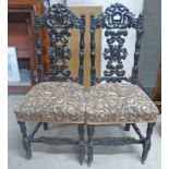 PAIR OF CARVED HALL CHAIRS DECORATED WITH CARVED PANELS IN 17TH CENTURY STYLE
