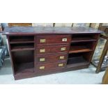 LATE 20TH CENTURY MAHOGANY OPEN BOOKCASE WITH 4 DRAWERS ON PLINTH BASE