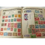 THE QUEEN POSTAGE STAMP ALBUM CONTAINING 19TH & 20TH CENTURY WORLDWIDE STAMPS