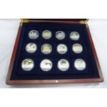 SELECTION OF SILVER PROOF H.C. ANDERSON COMMEMORATIVE ISSUE IN A WOODEN PRESENTATION CASE.