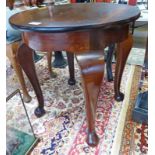 CIRCULAR MAHOGANY TABLE ON SHAPED SUPPORTS