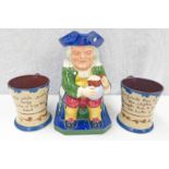 MOTTO WARE SPODE JUG IN THE FORM OF A SEATED MAN TOGETHER WITH TWO MOTTO WARE CUPS