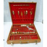 TEAK CASED CANTEEN OF BRASS CUTLERY