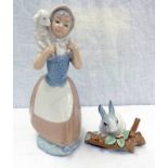 TWO LLADRO PORCELAIN FIGURES ONE OF A GIRL CARRYING A LAMB TOGETHER WITH RABBIT