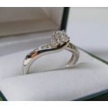 9CT GOLD DIAMOND SOLITAIRE RING WITH DIAMOND SET SHOULDERS