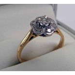 DIAMOND CLUSTER RING MARKED 18CT & PLAT Condition Report: Diamonds are too small to