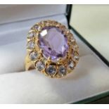 OVAL AMETHYST & WHITE STONE RING IN CLAW SETTING