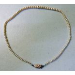 GRADUATED CULTURED PEARL NECKLACE ON CLASP MARKED 9CT