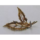 9CT GOLD DIAMOND SET BROOCH Condition Report: Weight: 4.8g, 5.2cm long.