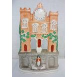 19TH CENTURY STAFFORDSHIRE POTTERY CLOCK TOWER - 37.