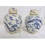 PAIR OF CHINESE BLUE & WHITE LIDDED GINGER JARS DECORATED WITH DRAGONS WITH FAINT RING MARKS TO