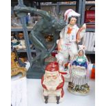 STAFFORDSHIRE POTTERY FIGURE OF A GENTLEMAN AND DOG, A LIDDED SANTA CLAUS BISCUIT JAR AND OTHERS.