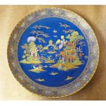 CARLTON WARE WALL PLAQUE DECORATED WITH ORIENTAL SCENE ON A BLUE BACKGROUND - 38CM DIAMETER