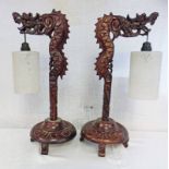 PAIR OF ORIENTAL WOODEN CARVED TABLE LAMPS WITH DRAGON DECORATION.